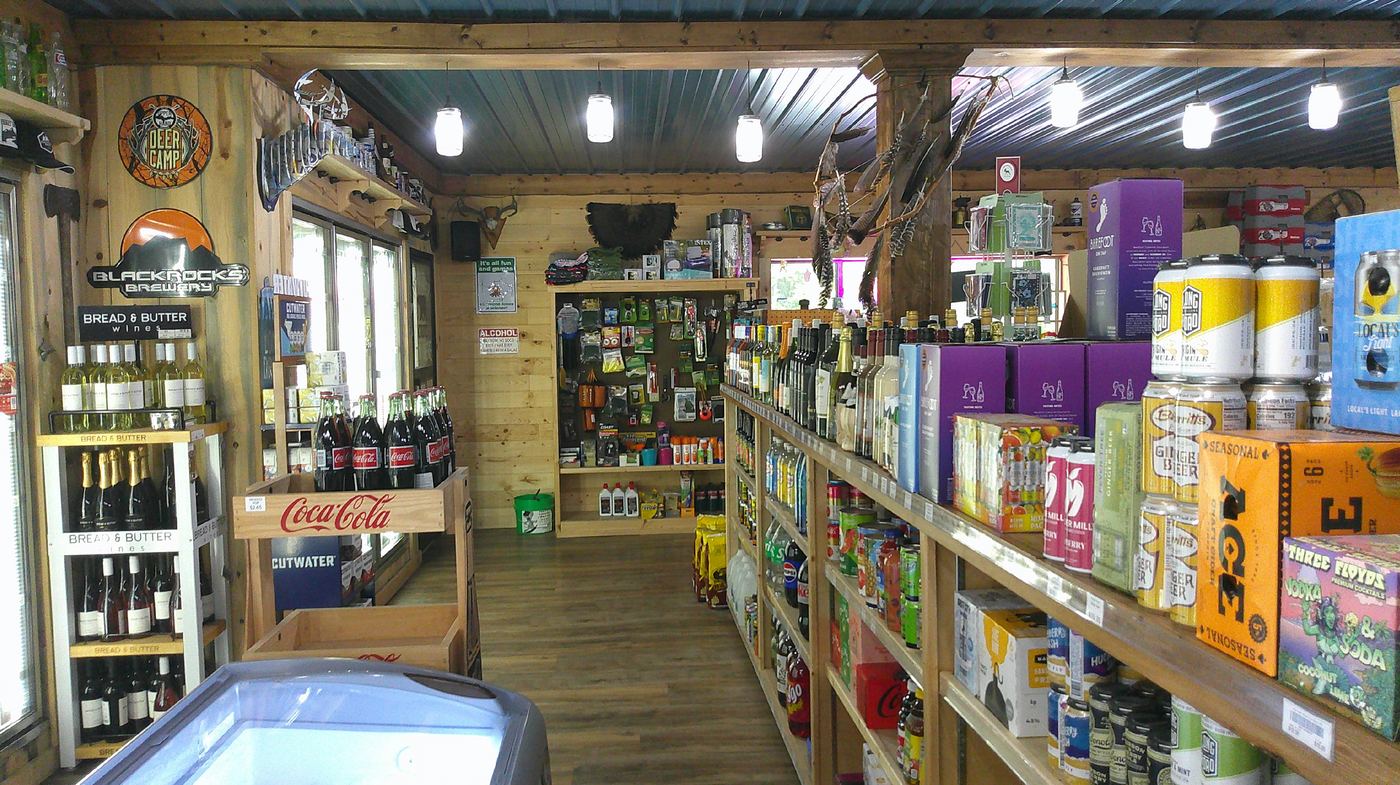 Main store aisle with beverages and local goods